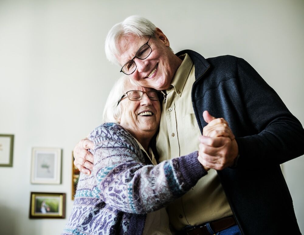 Senior couple dancing at their Senior Living Apartments Fresno ca